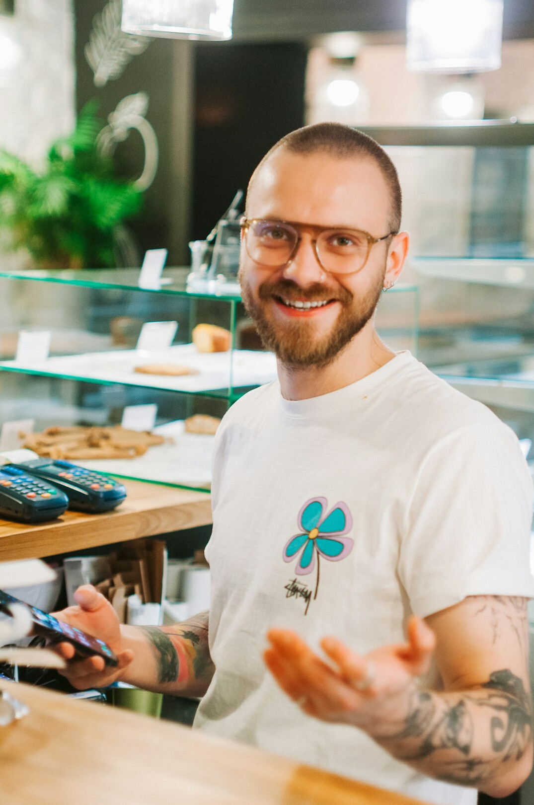 Bearded man in glasses smiling, co-founder of a storytelling project